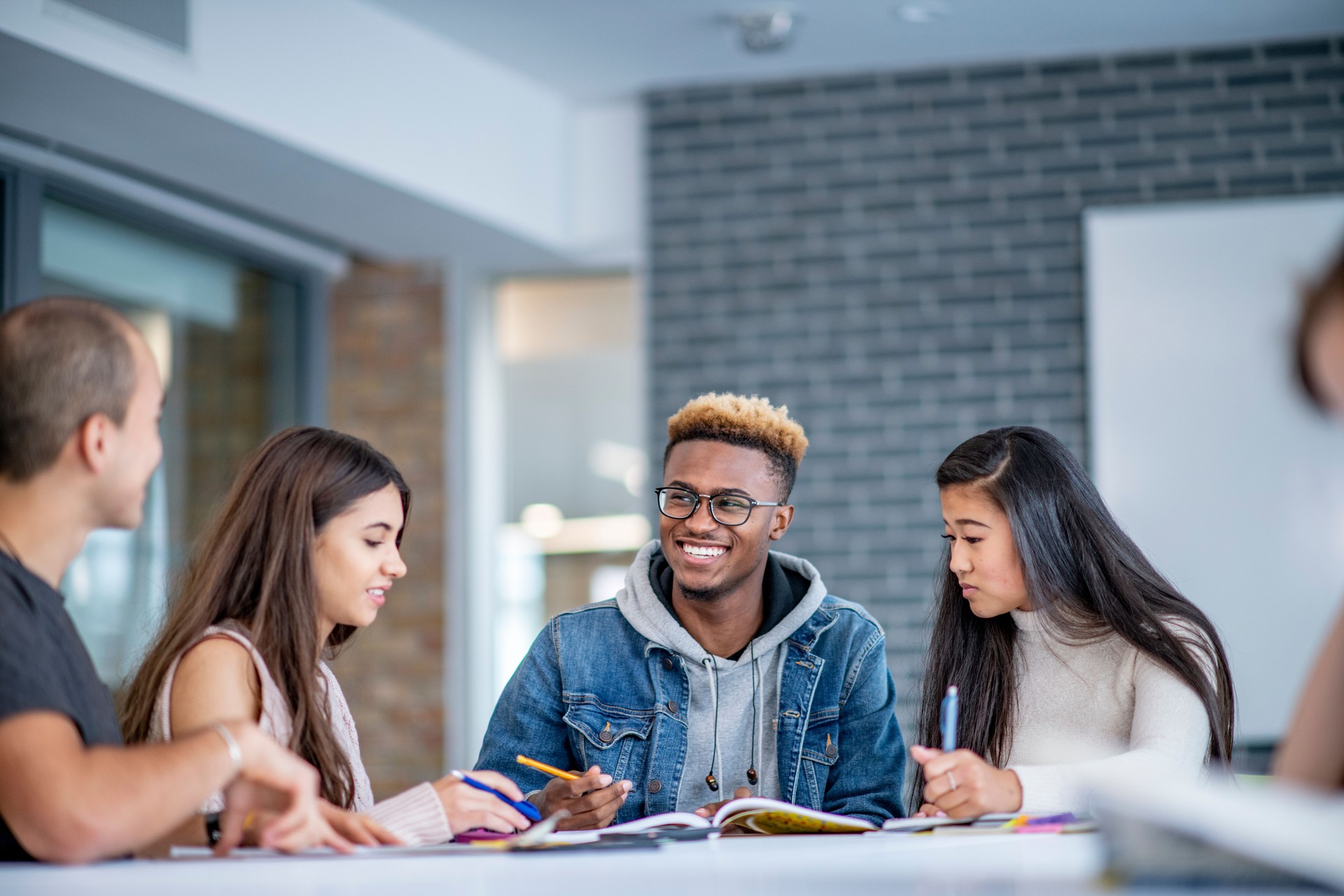 University students having fun while studying together
